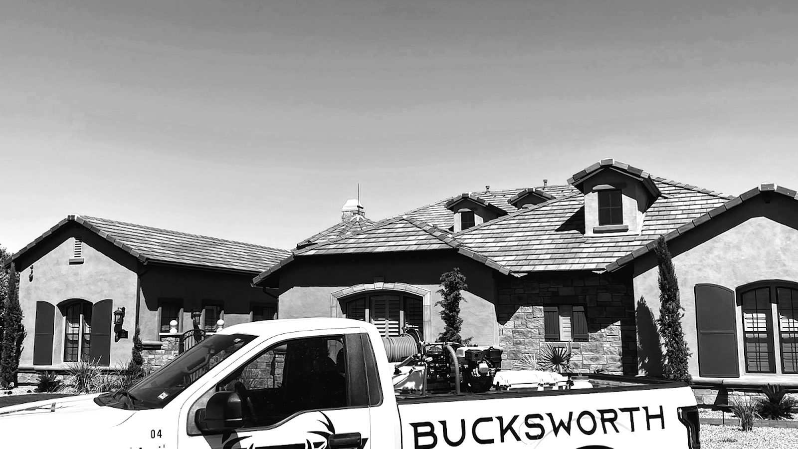 Bucksworth branded truck parked in front of a beautiful Arizona home