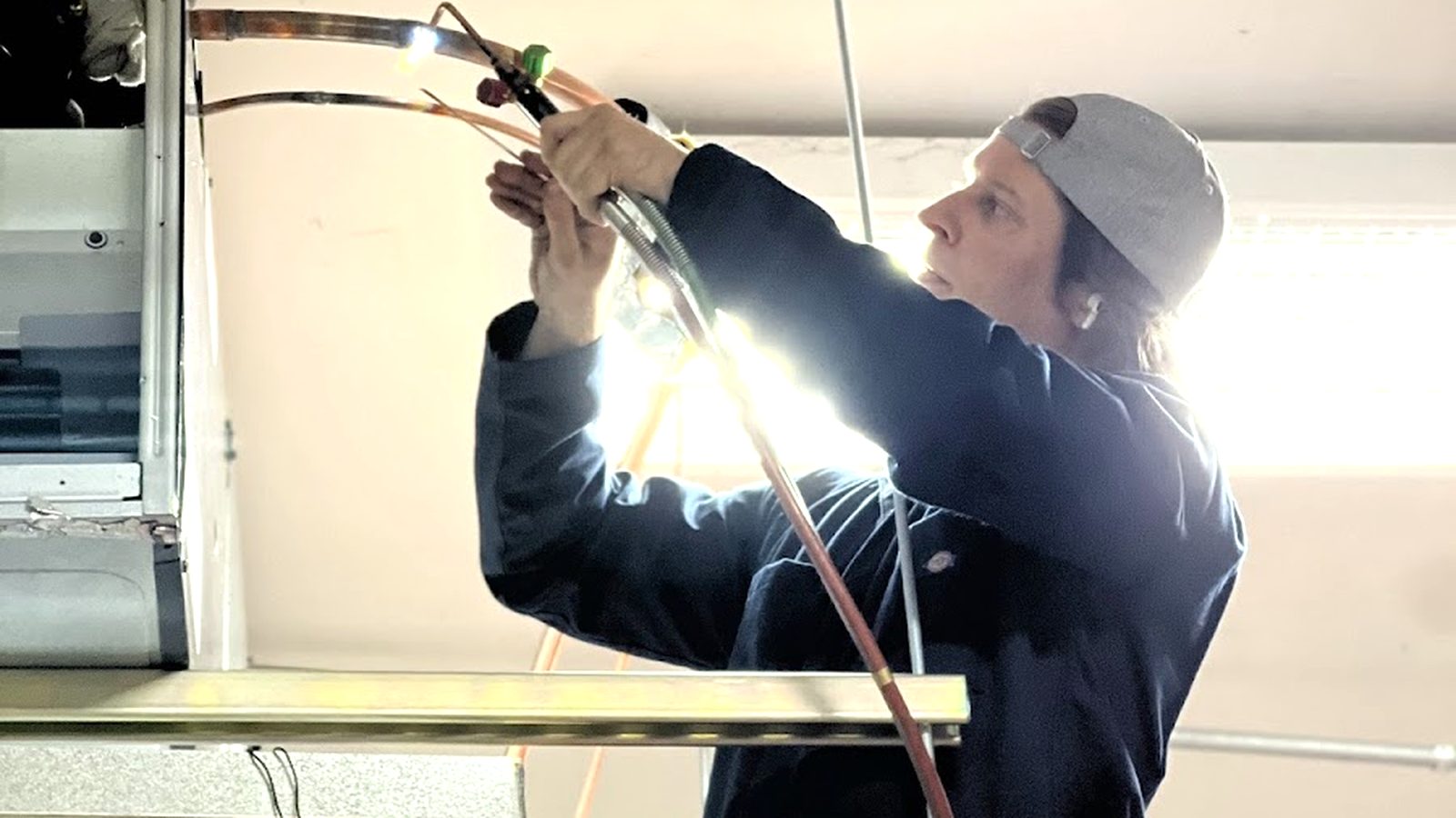 Bucksworth HVAC technician soldering copper refrigerant lines